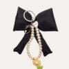 Large black bow with pearl & charm drop