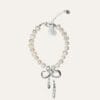 Pearl bracelet with silver bow charm