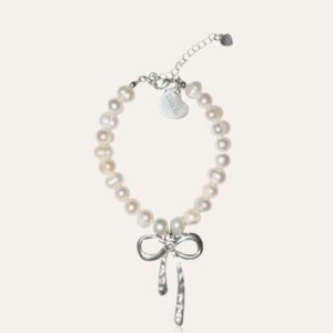 Pearl bracelet with silver bow charm