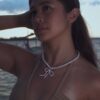 Pearl necklace with pink bow charm