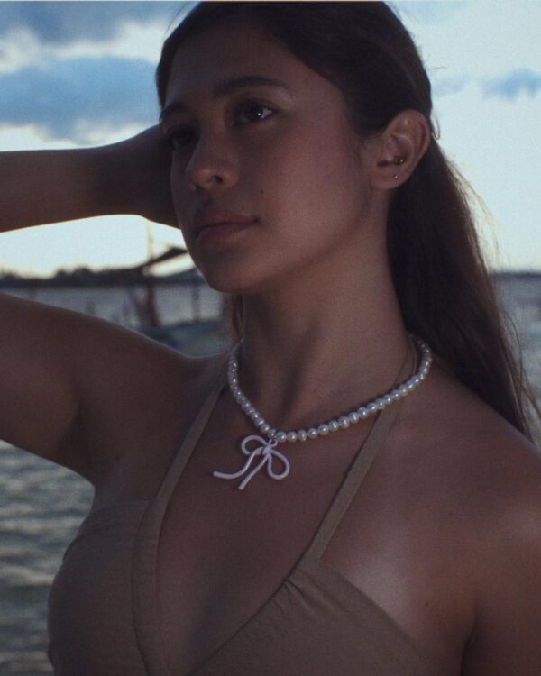 Pearl necklace with pink bow charm