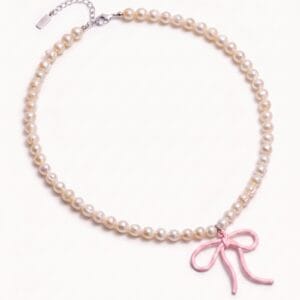 Pearl necklace with pink bow charm