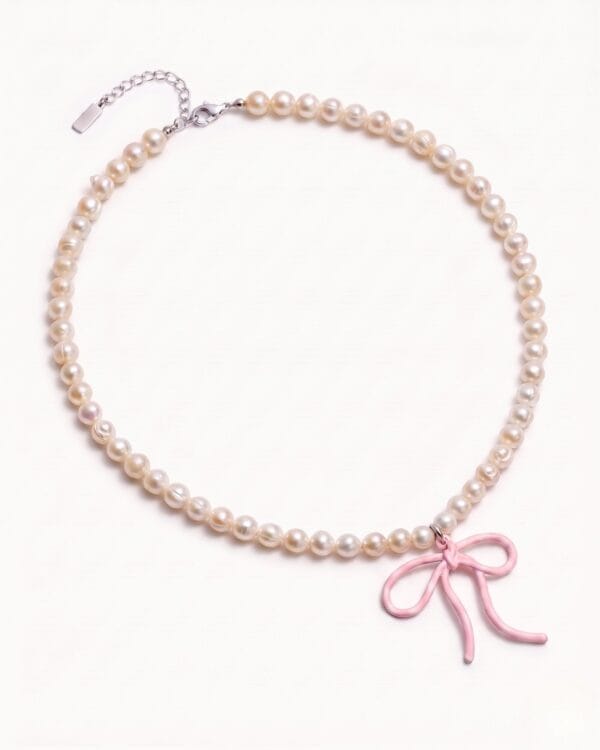 Pearl necklace with pink bow charm