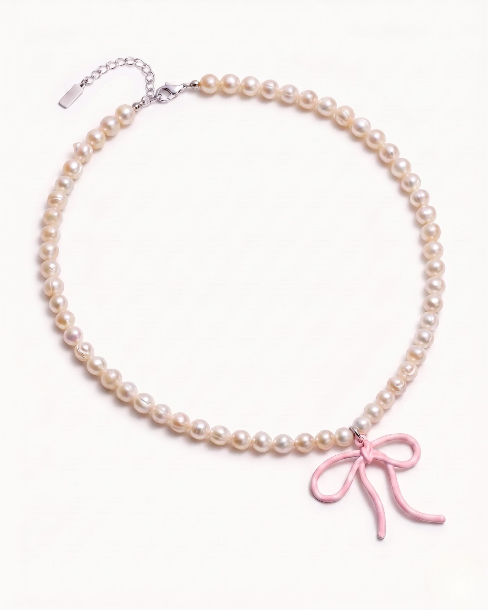 Pearl necklace with pink bow charm