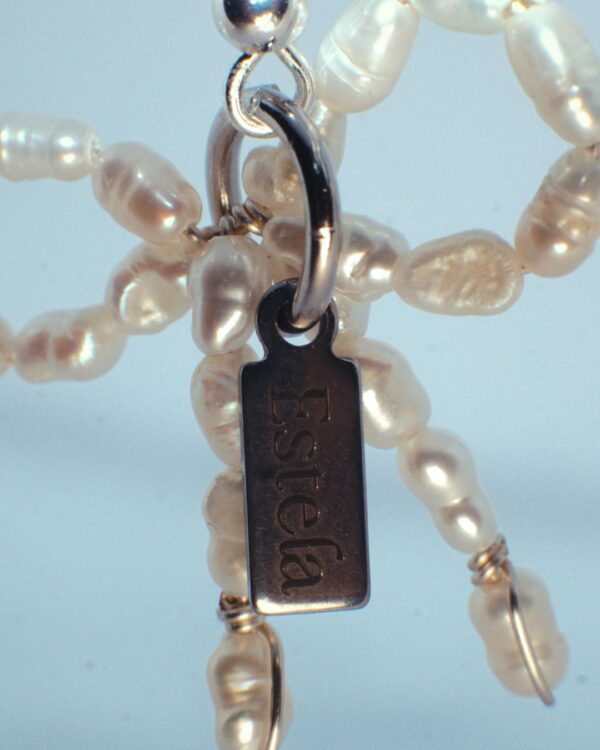 Earrings with pearl bows