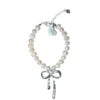 Pearl bracelet with silver bow charm