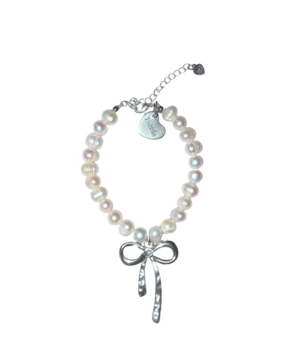 Pearl bracelet with silver bow charm